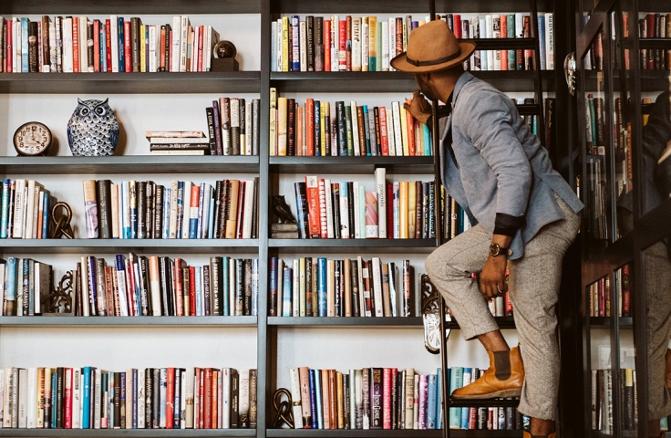 Man Picking Books in the Library