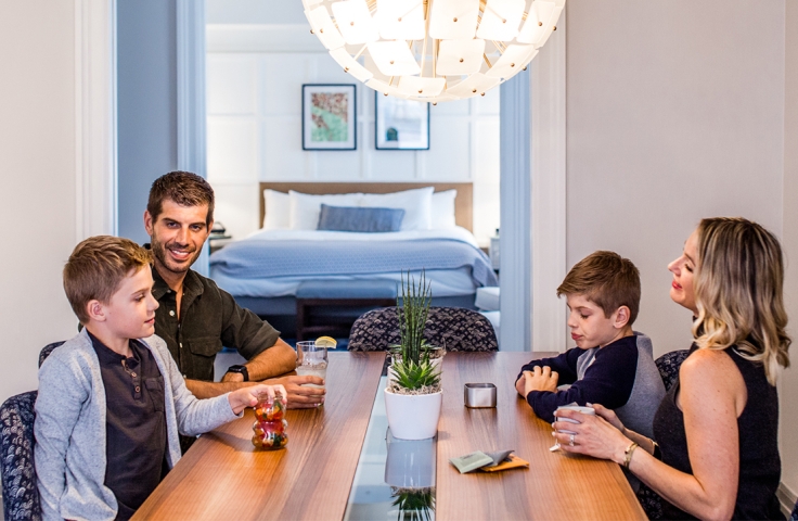 A family sitting in the dining area