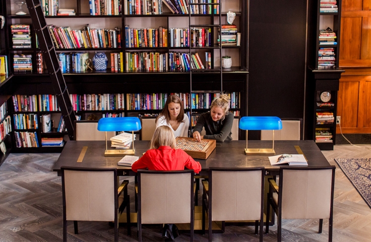 Three ladies playing scrabble