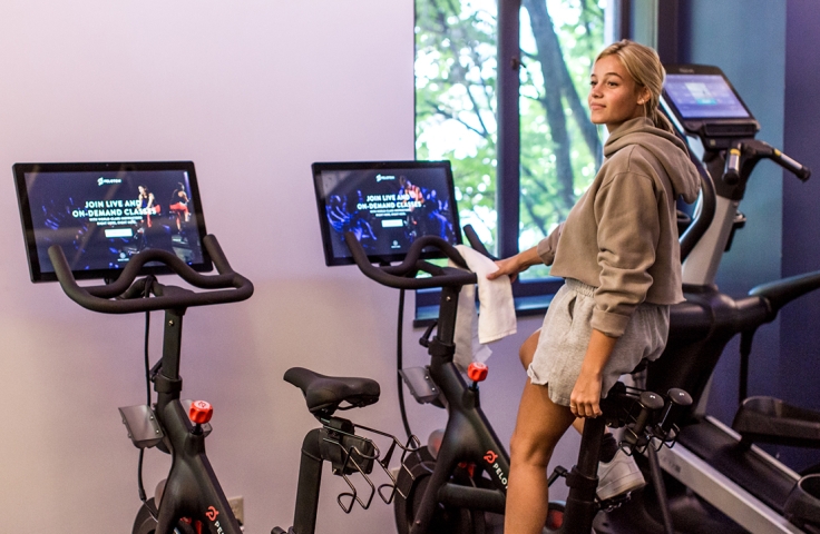 A lady on her stationary bike