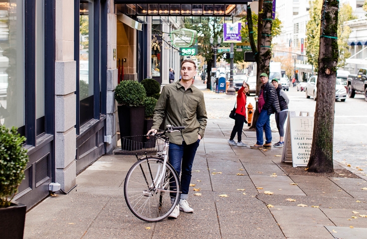 Man standing with his bicycle