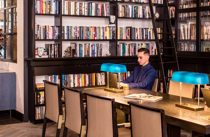 Man sitting in front of his Laptop